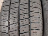 a close up of four tires on a wooden surface