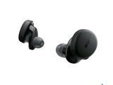 a pair of black earphones sitting next to each other on a white surface
