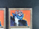 these are two cards from a card game that have been altered to look like they are in the same picture