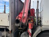 a truck that has a crane on the back of it