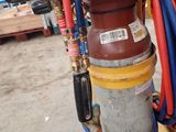 a red and blue hose attached to a red and yellow fire hydrant