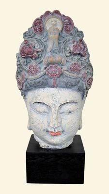statue of a woman with a flowered head on a black base