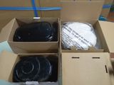 four boxes of black plastic items in a cardboard box