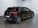 the rear end of a black car in a showroom