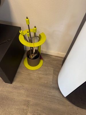 a black and yellow table with a cup of coffee on it