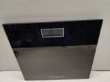 an image of a black and silver dishwasher on a white surface