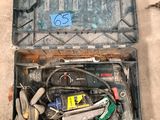 a tool box with tools inside of it on the floor