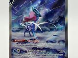 a close up of a pokemon card on a white surface