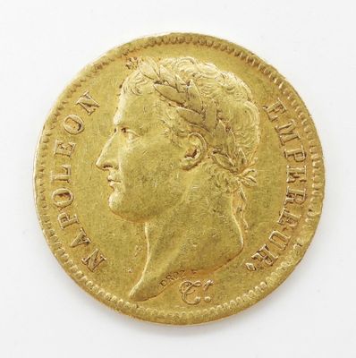 l'image d'une pièce d'or sur laquelle figure le visage d'une femme