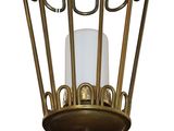 a light that is hanging from the ceiling in a cage