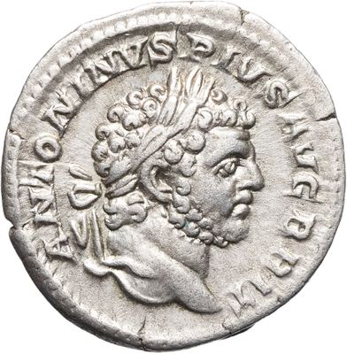 une pièce d'argent représentant la tête d'un homme coiffé d'une couronne