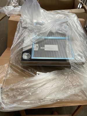 a laptop sitting on a table covered in plastic wrap