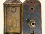 two old metal door knobs on a white background