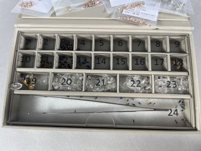 a box with a lot of beads in it
