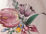 a decorative plate with a flower design on it
