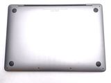 the back of a silver laptop computer sitting on top of a white surface