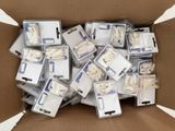 a cardboard box full of electronic devices in it