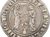 a close up of a silver coin with a man and woman on it