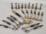 a lot of silver spoons and spoon spoons on the table