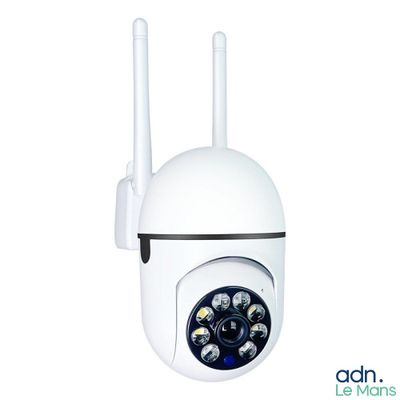 a close up of a white camera mounted on a wall