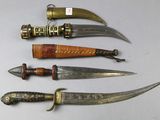 several different types of knives are lined up on a table