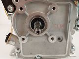 a close up of a motorcycle engine on a white surface