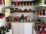 a large pantry with lots of food and condiments on the shelves