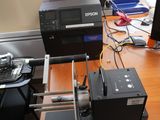 an image of a desktop computer and printer on a desk