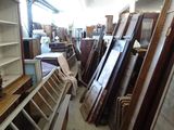 a room filled with lots of old windows and shelves