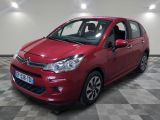 the red citrole is parked on a checkered floor