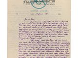 une lettre écrite à l'encre violette sur une feuille de papier