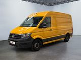 the yellow van is parked in a large room with a black floor