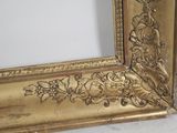 a picture of a gold picture frame on the floor