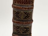 books stacked on top of each other on a white surface