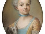 portrait of a young girl holding a dog in a blue dress