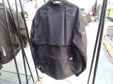 a black jacket hanging on a rack in a store