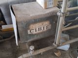a box sitting on top of a machine in a room