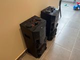 two speakers that are sitting next to each other on the floor