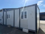 an image of a portable home in a parking lot