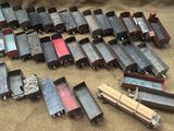 a lot of toy trains that are on the ground