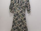 the dress is hanging on a hanger on the wall