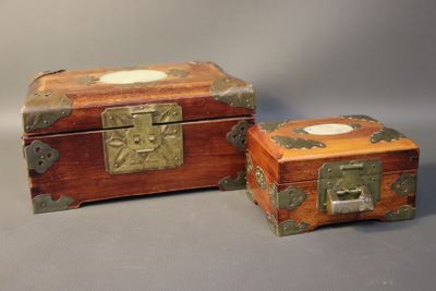 two wooden boxes that are sitting next to each other