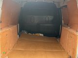 the back of a van with a cardboard box in the back of it