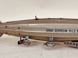 a small model of an air plane on a white surface