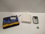 a cell phone and a book on a white table