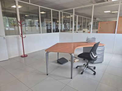 a room with a desk and a chair in it