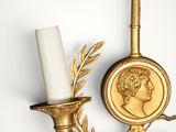 an image of a gold candle holder with a coin on top of it