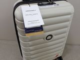 a suitcase with a tag on it sitting on the floor