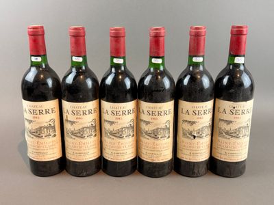 six bottles of wine are lined up in a row on a table