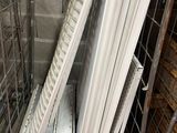 many pieces of metal on a shelf in a room